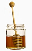 Honigglas mit Honiglöffel