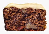 A piece of carrot cake with glacé icing