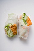 Two Vietnamese rice paper rolls with vegetable filling