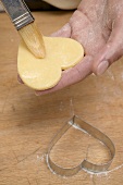 Heart-shaped biscuit with pastry brush and biscuit cutter