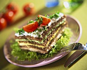 Wholegrain bread layered with fish, curry & avocado spread