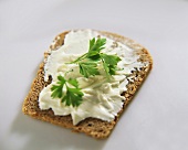 Soft cheese and parsley on wholemeal bread