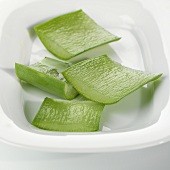 Aloe vera leaves, sliced open and cut into pieces