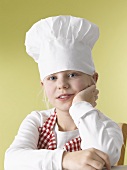 Girl in chef's hat and apron