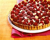 Raspberry tart with flaked almonds