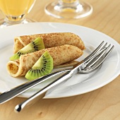 Pancakes garnished with kiwi fruit