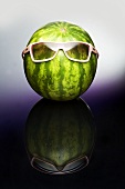 A watermelon wearing sunglasses