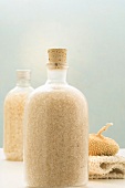 Bath salts in two bottles and other bath accessories