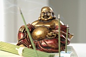 Green tea incense sticks with Buddha figure