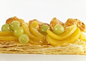 Puff pastry with peach slices and grapes