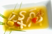 Chicken and carrot soup with alphabet pasta