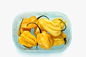 Yellow habanero chillies in a plastic tray