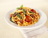 Tagliatelle with cherry tomatoes, spinach and olives