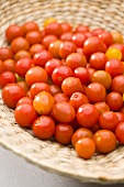 Cocktail tomatoes in a woven basket