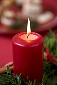 A burning candle on an Advent wreath