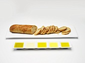 Baguette and various types of olive oil for tasting