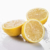 Three freshly washed lemon halves
