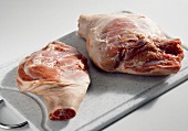 Cochon de lait (shoulder and leg) on a chopping board