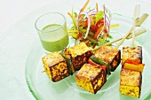 Paneer tikka (Indian cheese dish) with a mint dip