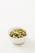 A bowl of cardamon capsules