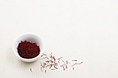 Saffron threads in a bowl and next to it