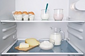 An open fridge with dairy products