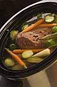 Cooked beef in vegetable broth