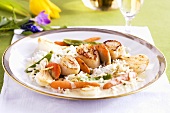 A scallop kebab with rice and carrots