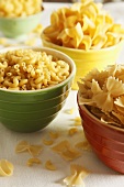 Various Pastas in Colored Bowls