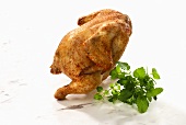 A whole roast chicken and fresh herbs