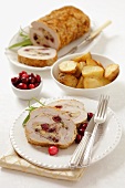 Pork roulade with mushrooms, cranberries and roast potatoes