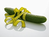 A cucumber with a tape measure