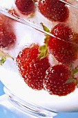 Frozen strawberries in a glass