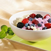 Rice pudding with mixed berries and fruit sauce