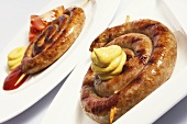 Coiled sausages with mustard