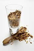 Crunchy muesli in and beside glass