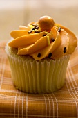 Muffin with orange cream topping