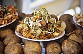Plate of Fried Potato Chips on Whole Potatoes at a Fair