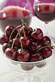 Cherries in a stemmed glass bowl