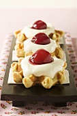 Waffles with vanilla cream and cherries