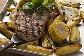 Grilled pork chop on roasted vegetables