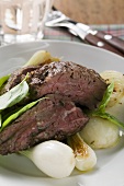 Roast beef with spring onions and basil