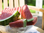 Watermelon wedges in a bowl of ice cubes