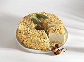 Soft cheese with a coating of pineapple and nuts