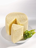 Tilsiter cheese, a wedge cut, with grapes
