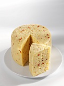 Tilsiter cheese with red pepper