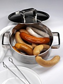 Various types of sausages in a pan