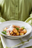 Gnocchi with tomato sauce, basil and grated cheese