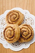 Three Danish pastry snails with nut filling
