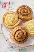 Danish pastry snails with nut and custard fillings